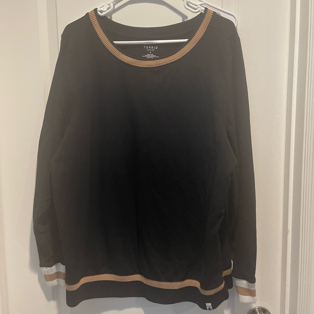 Torrid Active Black Top with Gold Trim used in great condition size XL.